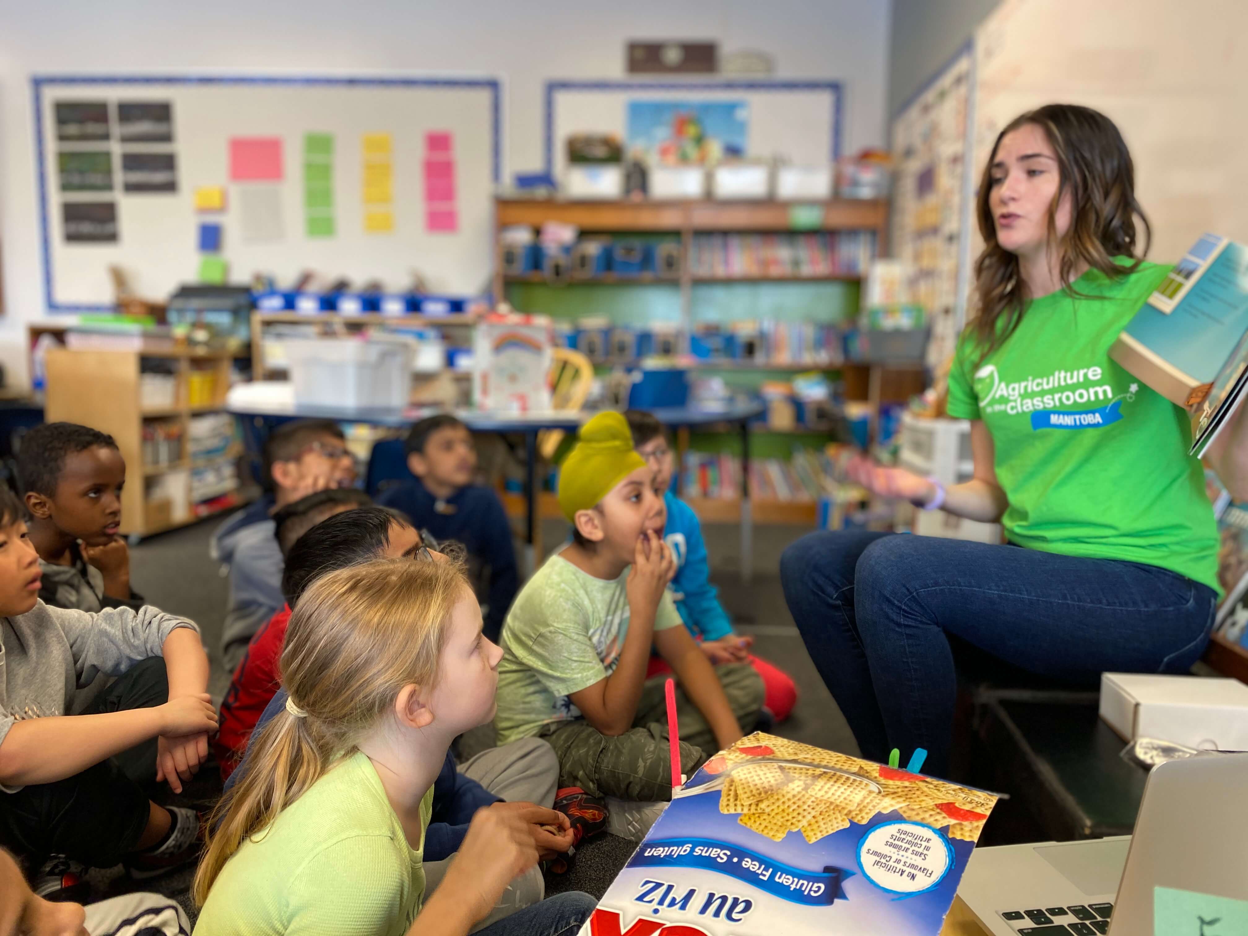 AITC-M volunteering presenting to early years classroom 