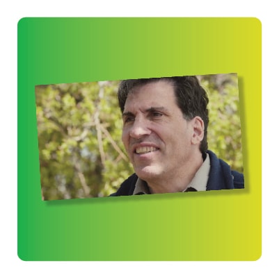 Video screenshot of Dr. Christian Artuso on a gradient background
